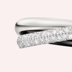 A Pre-Owned Cartier Trinity ceramic small model half-pavé ring