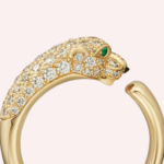 Pre-Owned Panthère de Cartier small model ring in 18K yellow gold, half-pavé set with diamonds and emerald eyes. An iconic luxury jewel.