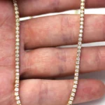 close detail 4 prong diamond tennis chain